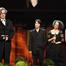 Wim Wenders on stage with some of the dancers who appear in Pina