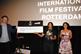 Kevin Macdonald with short doc winner Vincent Lauffer